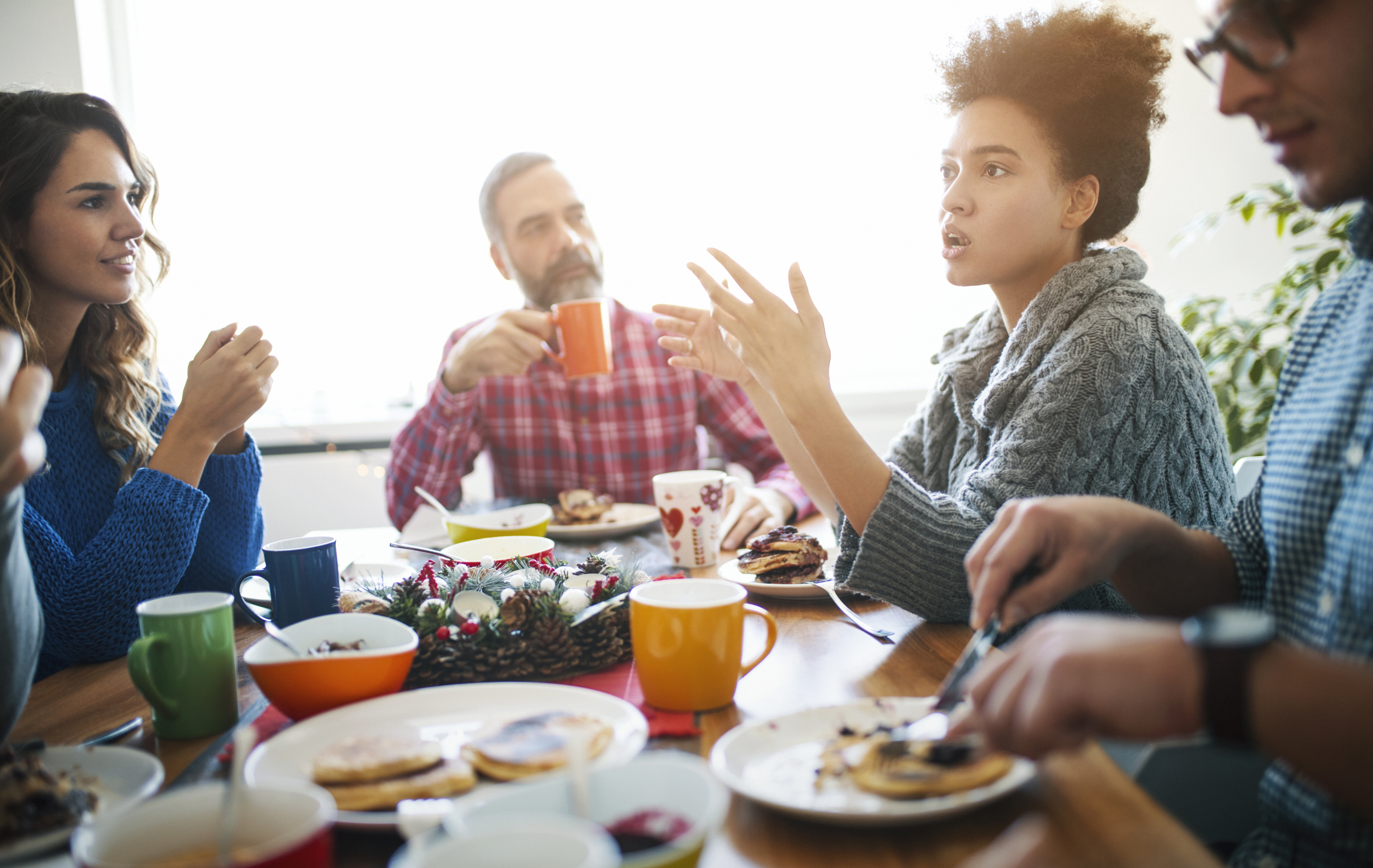 Group of people talking at table