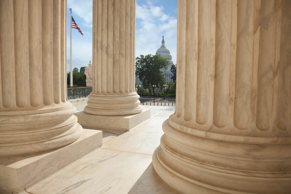 2025 Tax Law Changes Banner Image - DC Capitol is visible in the distance through columns