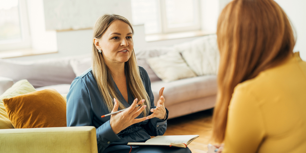 Two woman having discussion   
