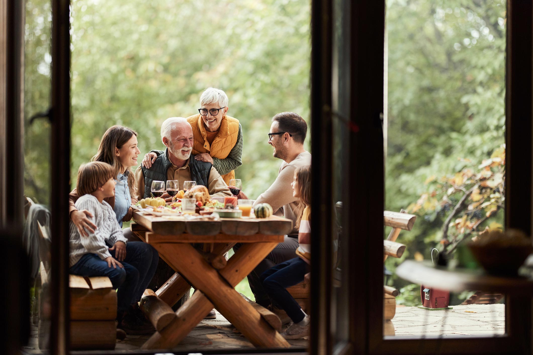 People seating outside at the dinner table