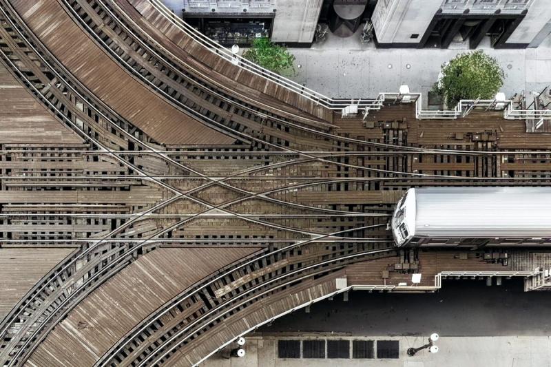 Bird view subway train photo that has three different tracks it can take